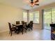 Bright dining area with table and chairs near sliding doors at 929 Windton Oak Dr, Ruskin, FL 33570