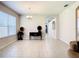 Bright dining room with tile floors and view into kitchen at 929 Windton Oak Dr, Ruskin, FL 33570