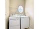 Laundry room with washer, dryer, and overhead shelving at 929 Windton Oak Dr, Ruskin, FL 33570