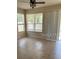 Room with tile flooring and sliding doors to patio at 929 Windton Oak Dr, Ruskin, FL 33570