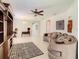 Living room with a curved sofa and an ornate area rug at 929 Windton Oak Dr, Ruskin, FL 33570