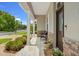 Inviting front porch with a stone accent wall and seating area at 9426 59 N St, Pinellas Park, FL 33782