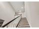 Elegant staircase with dark wood railing and carpeted steps at 9426 59 N St, Pinellas Park, FL 33782