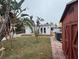 Large backyard with a hot tub, shed, and guest house at 944 Bruce Ave, Clearwater Beach, FL 33767