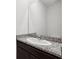 Bathroom vanity featuring a granite countertop and a sink at 9804 Rowing Dale Bnd, Wesley Chapel, FL 33545