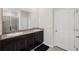 Bathroom with double sinks, granite countertops, and walk-in shower at 9804 Rowing Dale Bnd, Wesley Chapel, FL 33545