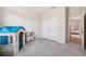 Spacious playroom with playhouse, toy kitchen, and ample storage near closet at 9804 Rowing Dale Bnd, Wesley Chapel, FL 33545