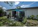 Backyard patio with table, chairs, and umbrella, perfect for outdoor dining at 5601 9Th N Ave, St Petersburg, FL 33710