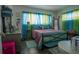 Bedroom with colorful bedding and plenty of natural light at 5601 9Th N Ave, St Petersburg, FL 33710