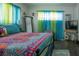 Bright bedroom featuring a large bed and colorful decor at 5601 9Th N Ave, St Petersburg, FL 33710