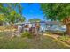 Backyard view showcasing patio furniture and lush greenery at 10 N Mercury Ave, Clearwater, FL 33765