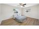 Cozy bedroom with wood-look floors and ceiling fan at 10 N Mercury Ave, Clearwater, FL 33765