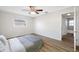 Bedroom featuring wood-look floors and access to bathroom at 10 N Mercury Ave, Clearwater, FL 33765