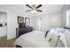 Bedroom with a queen bed, dresser, and view into the kitchen at 10 N Mercury Ave, Clearwater, FL 33765