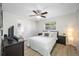 Light and airy bedroom with a queen bed and hardwood floors at 10 N Mercury Ave, Clearwater, FL 33765