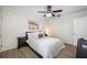 Bright bedroom with a queen-size bed, hardwood floors, and ceiling fan at 10 N Mercury Ave, Clearwater, FL 33765