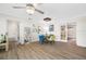 Bright dining area with wood table and four chairs, open to living room at 10 N Mercury Ave, Clearwater, FL 33765