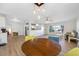 Open concept dining area with wood table and light wood flooring at 10 N Mercury Ave, Clearwater, FL 33765