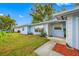 House exterior showcasing a light blue facade and walkway at 10 N Mercury Ave, Clearwater, FL 33765