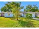 Light blue house with a well-maintained lawn and driveway at 10 N Mercury Ave, Clearwater, FL 33765