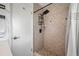 Updated shower with tile surround and shower caddy at 10 N Mercury Ave, Clearwater, FL 33765