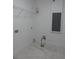 Small laundry room with white walls and marble-look flooring at 10008 N 20Th St, Tampa, FL 33612