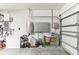 Garage interior featuring storage systems, work area and white painted walls at 10757 Carloway Hills Dr, Wimauma, FL 33598