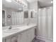 Bathroom featuring dual sinks, ample counter space, and a shower-tub combination at 11121 Sun Tree Rd, Hudson, FL 34667