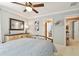 Bedroom featuring ceiling fan and access to Primary bathroom at 11132 Roseate Dr, Tampa, FL 33626