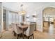 Elegant dining room featuring stylish lighting, neutral tones and a wooden table at 11132 Roseate Dr, Tampa, FL 33626