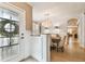 Elegant dining room featuring stylish wainscoting, and modern lighting at 11132 Roseate Dr, Tampa, FL 33626