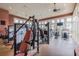 Modern gym featuring exercise equipment and large windows providing plenty of natural light at 11132 Roseate Dr, Tampa, FL 33626