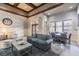 Cozy living room with a sofa, armchairs, coffee table, and a dining table with chairs under natural light at 11132 Roseate Dr, Tampa, FL 33626