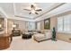 Inviting living room with coffered ceilings, neutral furniture, and lots of natural light at 11132 Roseate Dr, Tampa, FL 33626