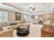 Comfortable living room with coffered ceiling, neutral furniture, and plenty of natural light at 11132 Roseate Dr, Tampa, FL 33626