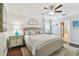 Inviting main bedroom with shiplap walls, a ceiling fan, and access to ensuite bath at 11132 Roseate Dr, Tampa, FL 33626