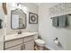 Well-appointed powder room with decorative mirror, stylish fixtures, and neutral decor at 11132 Roseate Dr, Tampa, FL 33626