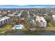 Aerial view of condo, pool, and lakefront at 11485 Oakhurst Rd # A301, Largo, FL 33774