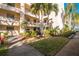 Lush landscaping surrounds this condo building, offering a welcoming entrance at 11485 Oakhurst Rd # A301, Largo, FL 33774