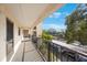 Private balcony overlooks parking and lush landscape at 11485 Oakhurst Rd # A301, Largo, FL 33774