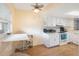 Efficient kitchen with white cabinets and appliances at 11485 Oakhurst Rd # A301, Largo, FL 33774