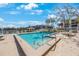 Community pool with gazebo and lake views at 11485 Oakhurst Rd # A301, Largo, FL 33774