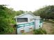 House with large deck and a detached shed at 12217 Peaceful Ave, Weeki Wachee, FL 34614