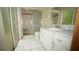 Bathroom with shower, toilet and vanity at 12217 Peaceful Ave, Weeki Wachee, FL 34614