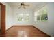 Bedroom with wood floors and window at 12217 Peaceful Ave, Weeki Wachee, FL 34614