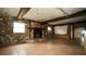 Living room with stone fireplace and tile flooring at 12217 Peaceful Ave, Weeki Wachee, FL 34614