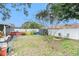 Spacious backyard with fire pit and colorful fence at 1232 Calamondin Dr, Holiday, FL 34691