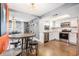 Kitchen with white cabinets, stainless steel appliances, and stained concrete floors at 1232 Calamondin Dr, Holiday, FL 34691