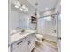 Clean bathroom with white subway tiles and gray vanity at 14610 Horse Trot Rd, Lithia, FL 33547