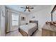 Cozy bedroom with wood furniture and window coverings at 14610 Horse Trot Rd, Lithia, FL 33547